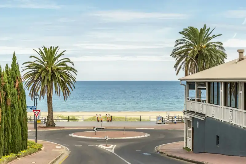 Blue and white wooden house near sea during daytime