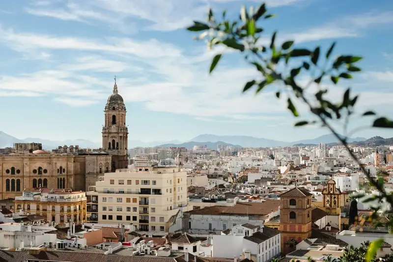 A view of a city with tall buildings and a clock tower
