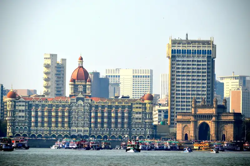 Taj mahal palace hotel, gateway of india, and mumbai skyline
