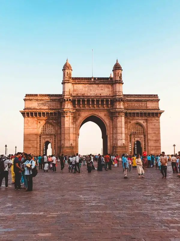 People walking on arch gate during daytime