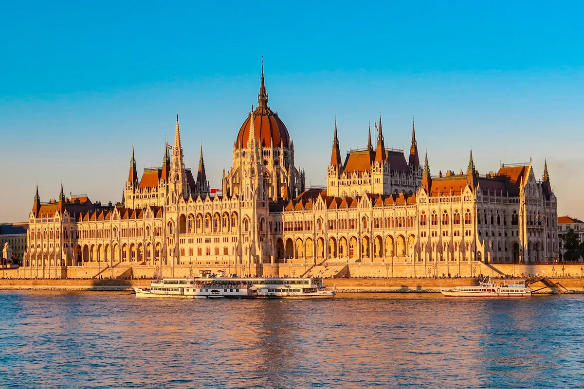 A large building sitting on top of a body of water
