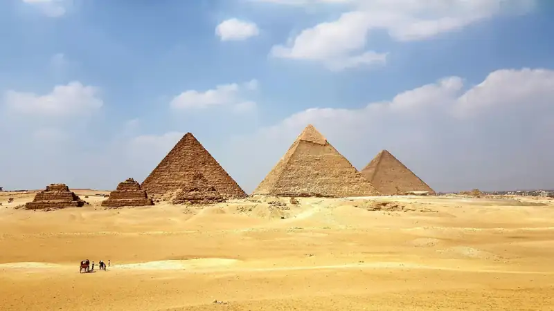 Brown pyramid under blue sky during daytime