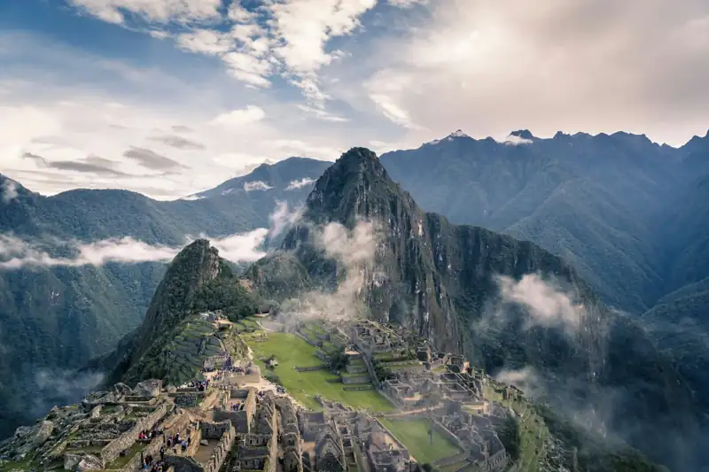 Machu picchu ruins among misty mountains