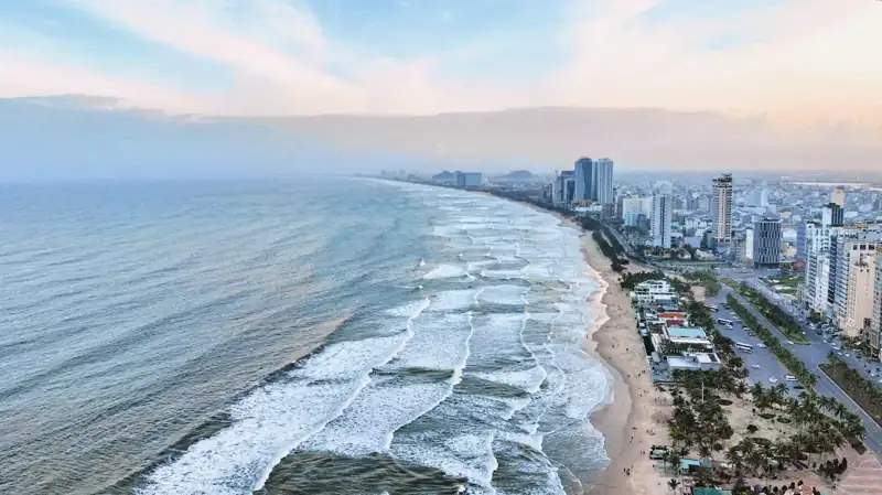 An aerial view of a beach and a city