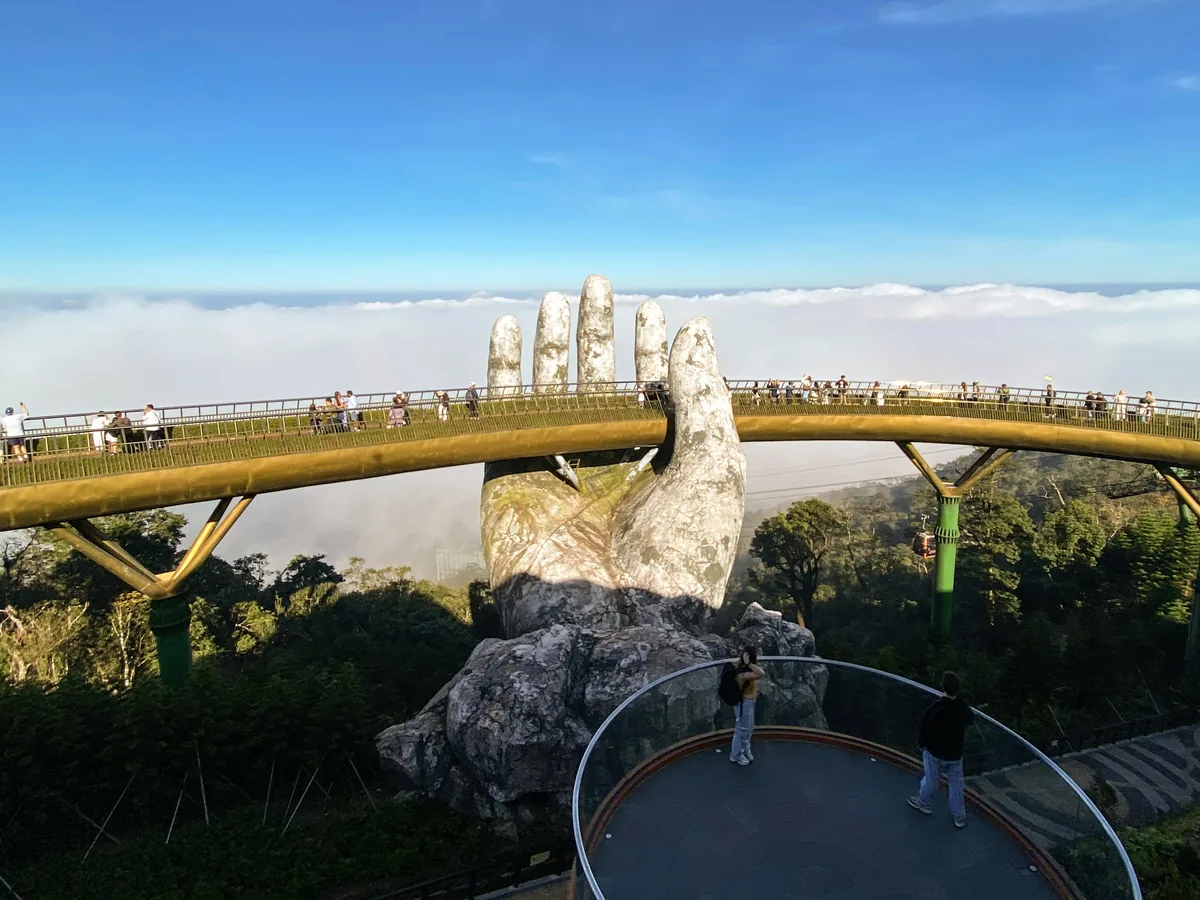 Golden bridge, held by giant hands in vietnam