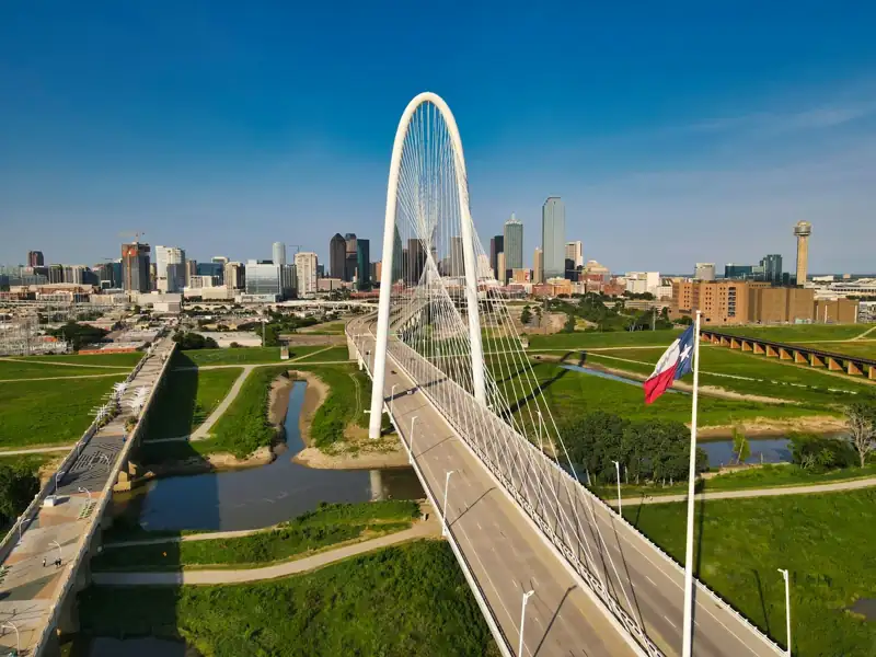 White bridge over city buildings during daytime