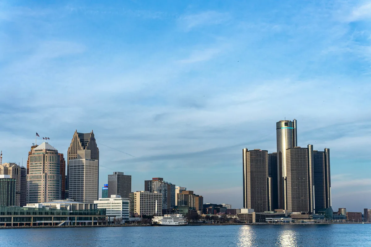 A large body of water with a city in the background