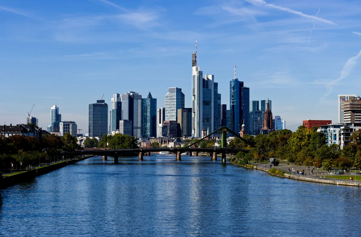 A river with a bridge and a city in the background