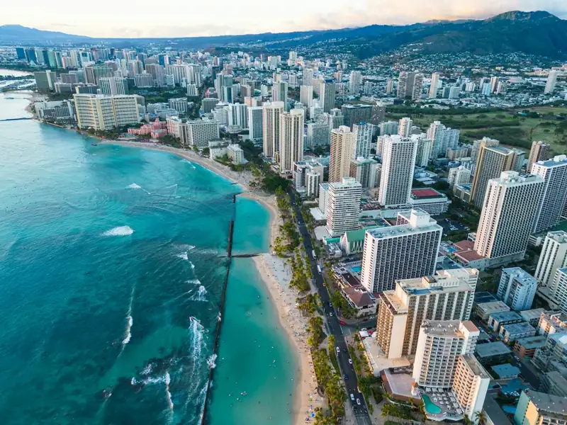 An aerial view of a city next to the ocean
