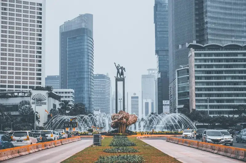 The Selamat Datang Monument fountain surrounded by skyscrapers in Jakarta, Indonesia