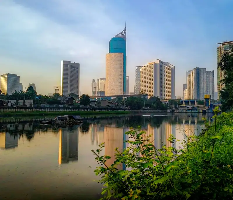 A body of water surrounded by tall buildings
