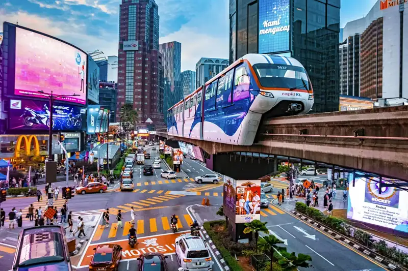 A city street filled with traffic and tall buildings