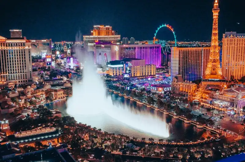 A city with a fountain in the middle of it
