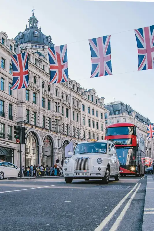 Photo of car and bus near castle