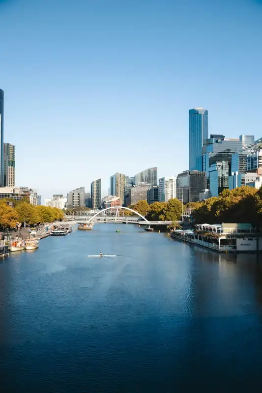 City skyline with river and bridge on a clear day