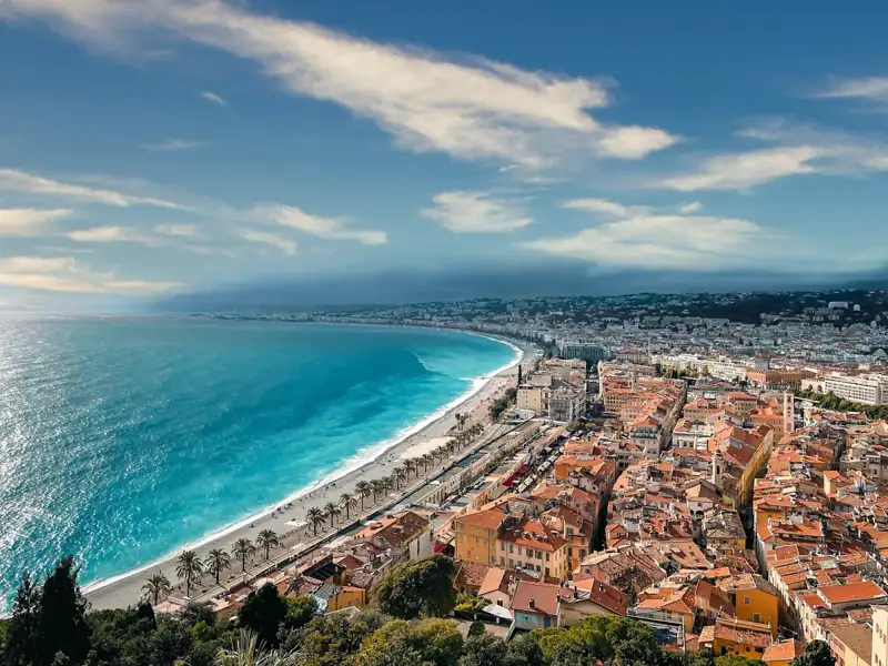 An aerial view of a city next to the ocean