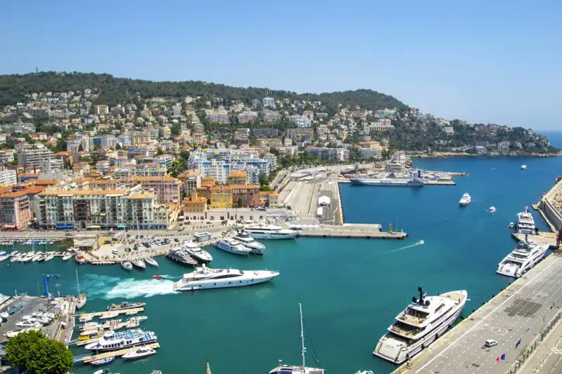 A harbor filled with lots of boats next to a city