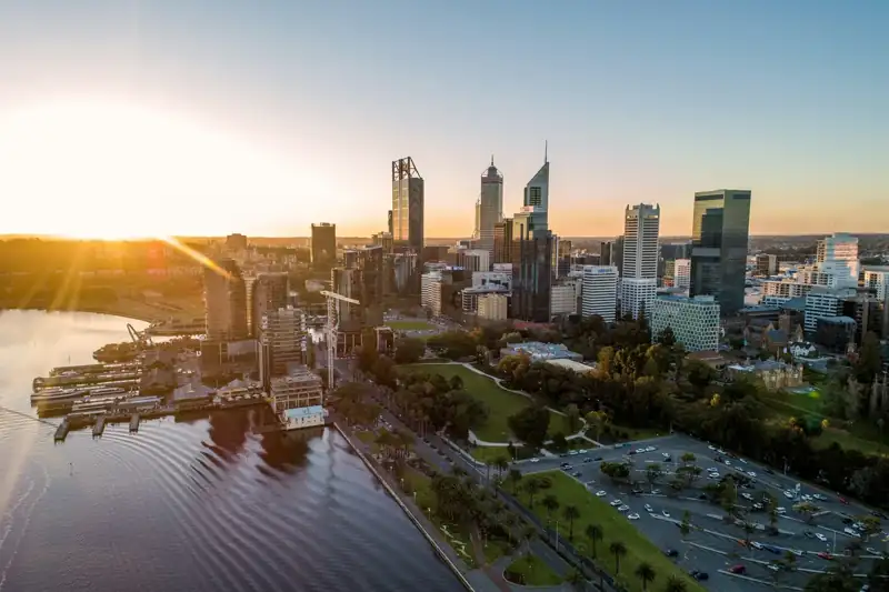City buildings near body of water during daytime