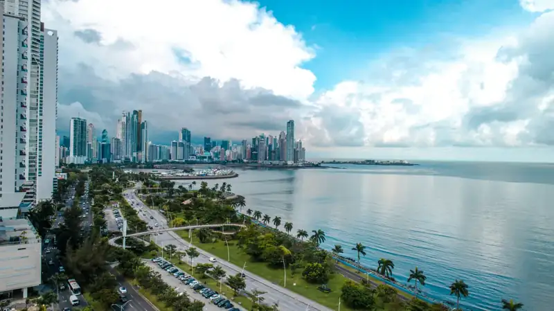 A large body of water with a city in the background