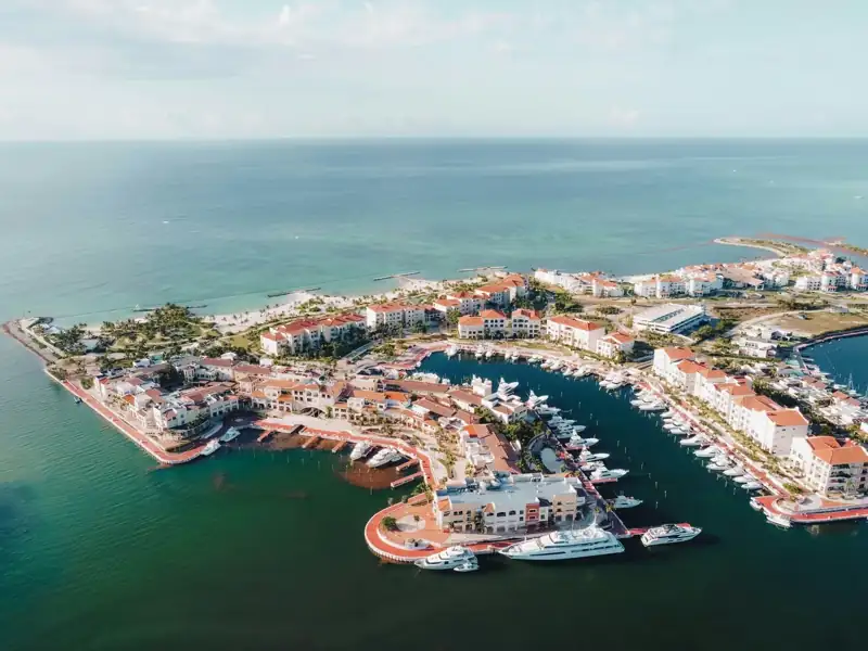 An aerial view of a marina in the middle of the ocean
