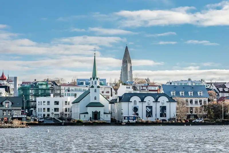 A large body of water with a city in the background