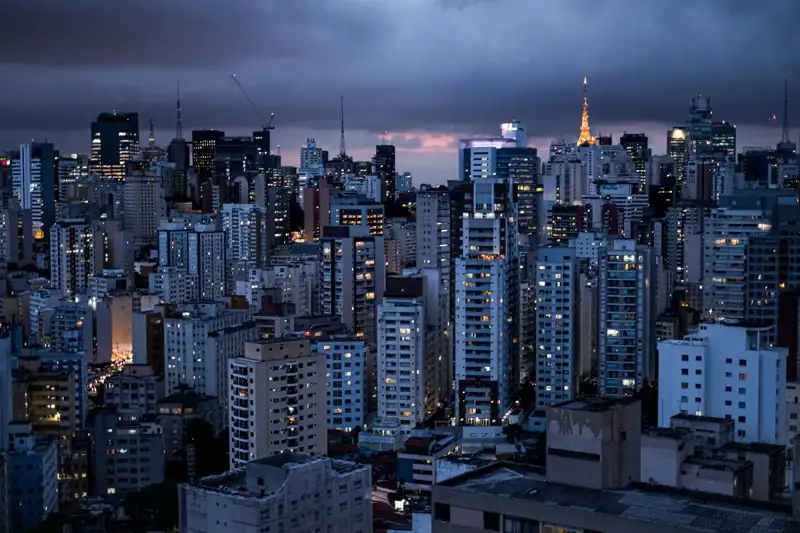 City skyline under gray cloudy sky during daytime