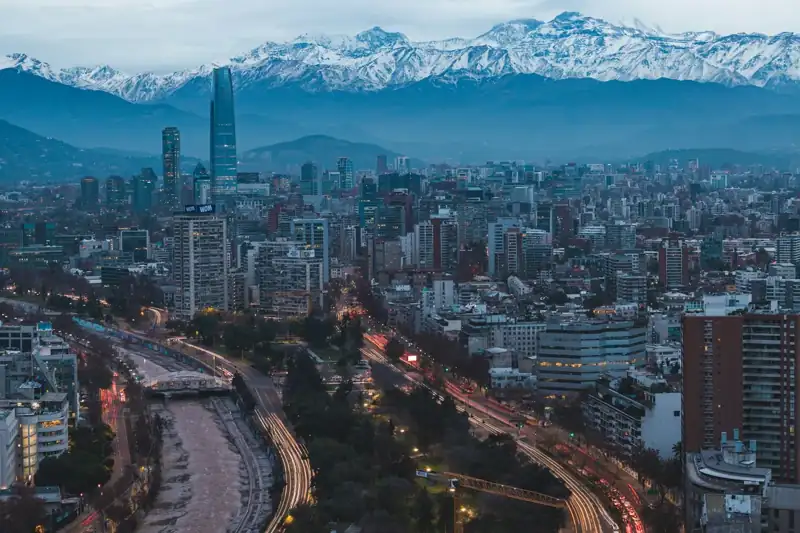 A view of a city with mountains in the background