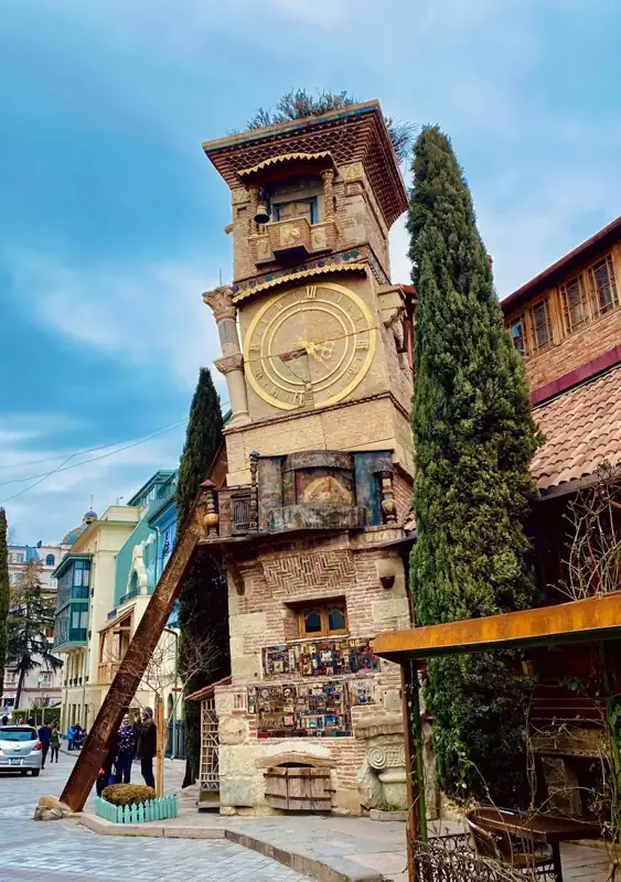 Brown concrete building with clock tower