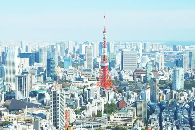 Aerial photography of red tower surrounded by buildings during daytime