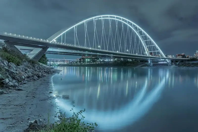 Gray metal bridge over river
