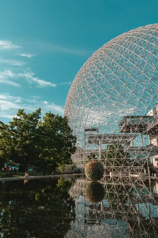 Gray stainless steel globe landmark under green skies