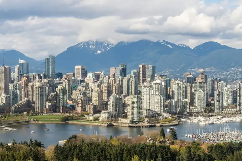 A view of a city with mountains in the background