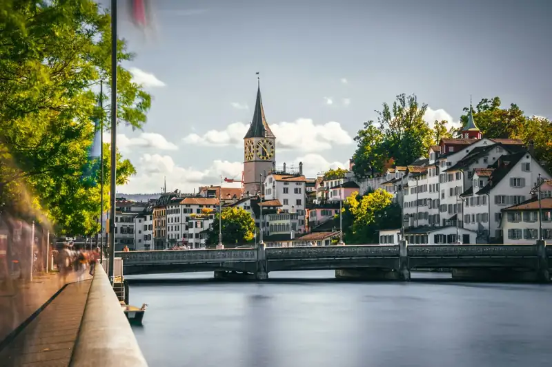 A bridge over a river with buildings on either side of it